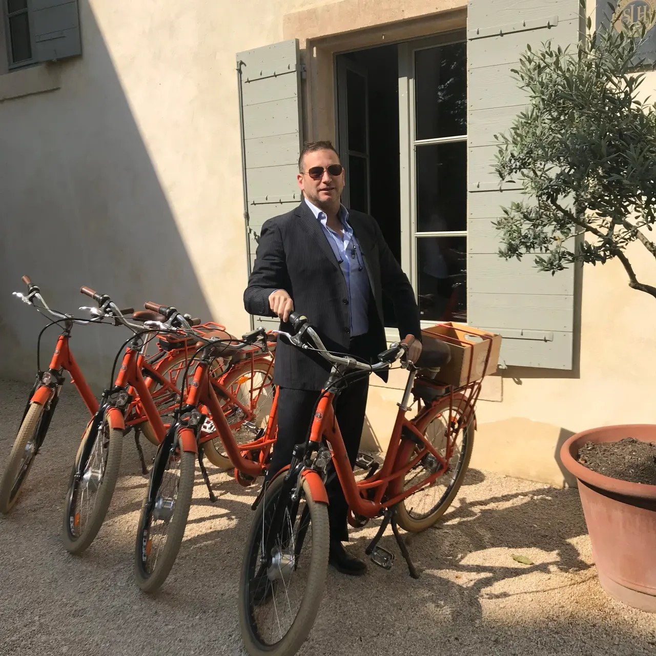 In a courtyard of orange bicycles