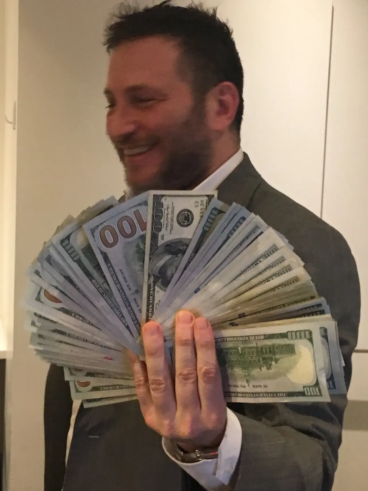 A fan of hundred-dollar bills