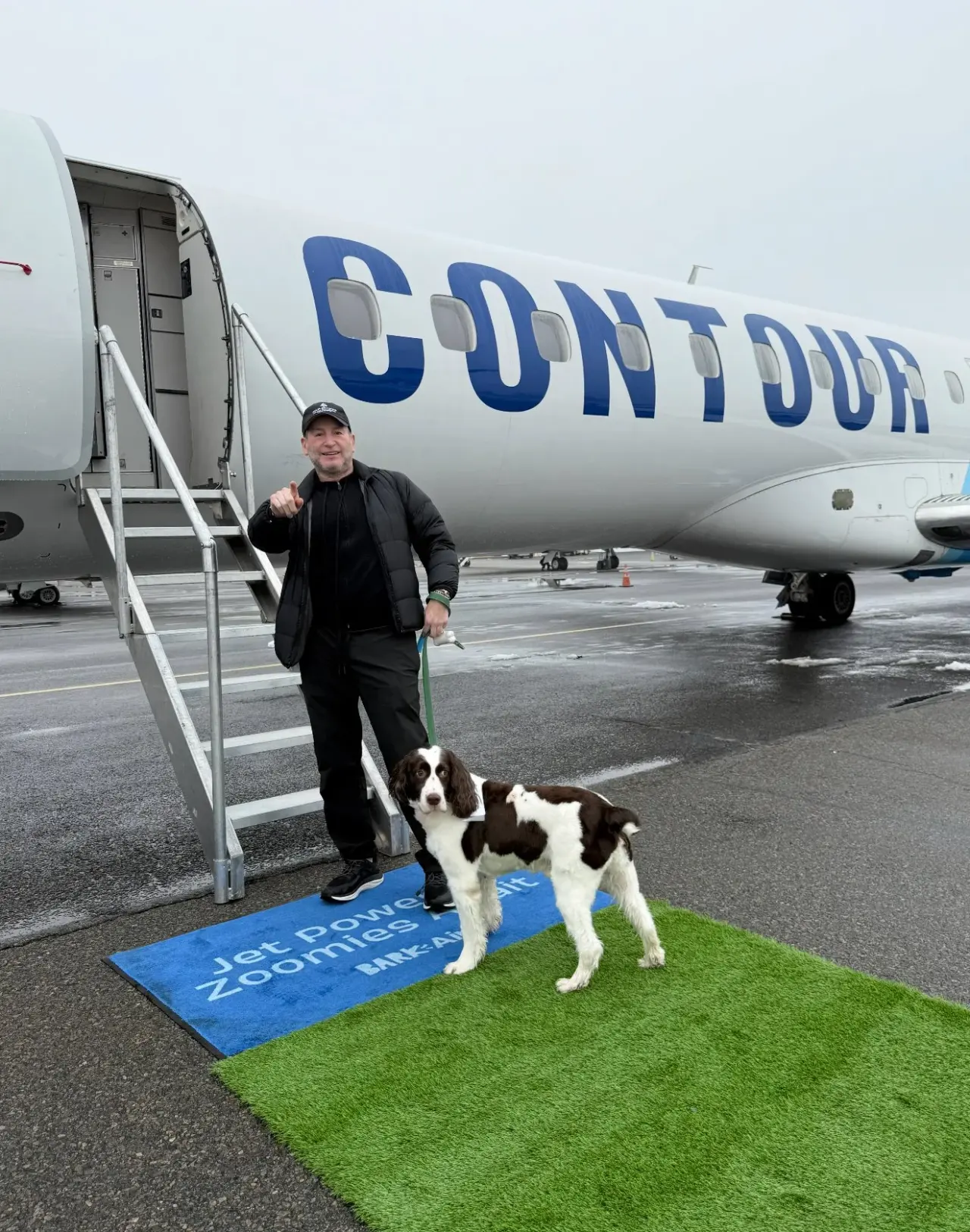 Boarding a charter flight with his dog