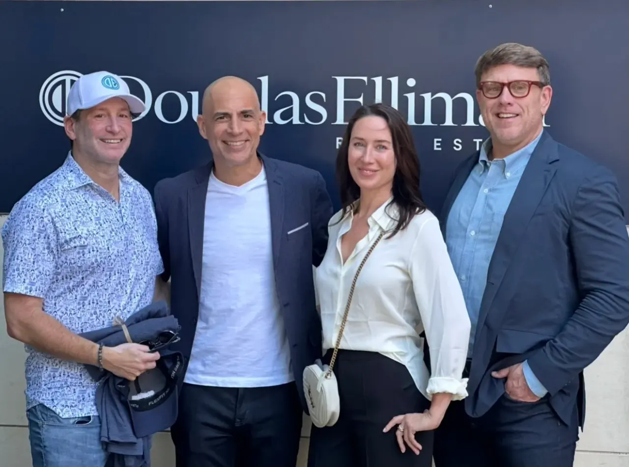 With colleagues at Douglas Elliman