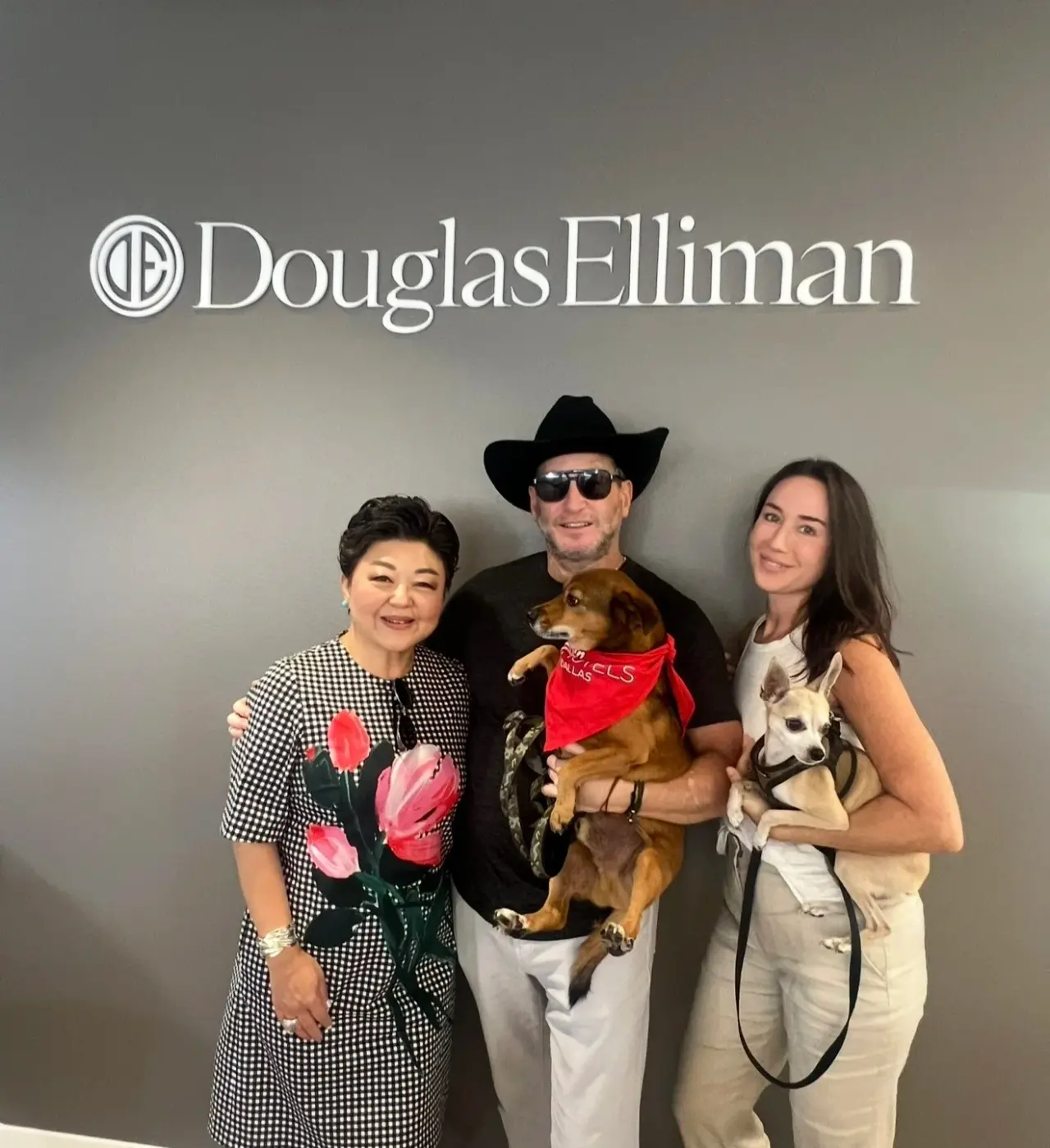 At Douglas Elliman with two of the rescue dogs