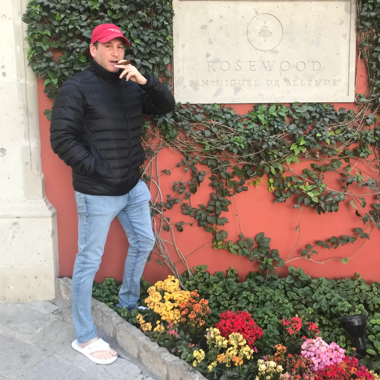 Against a red wall, abroad